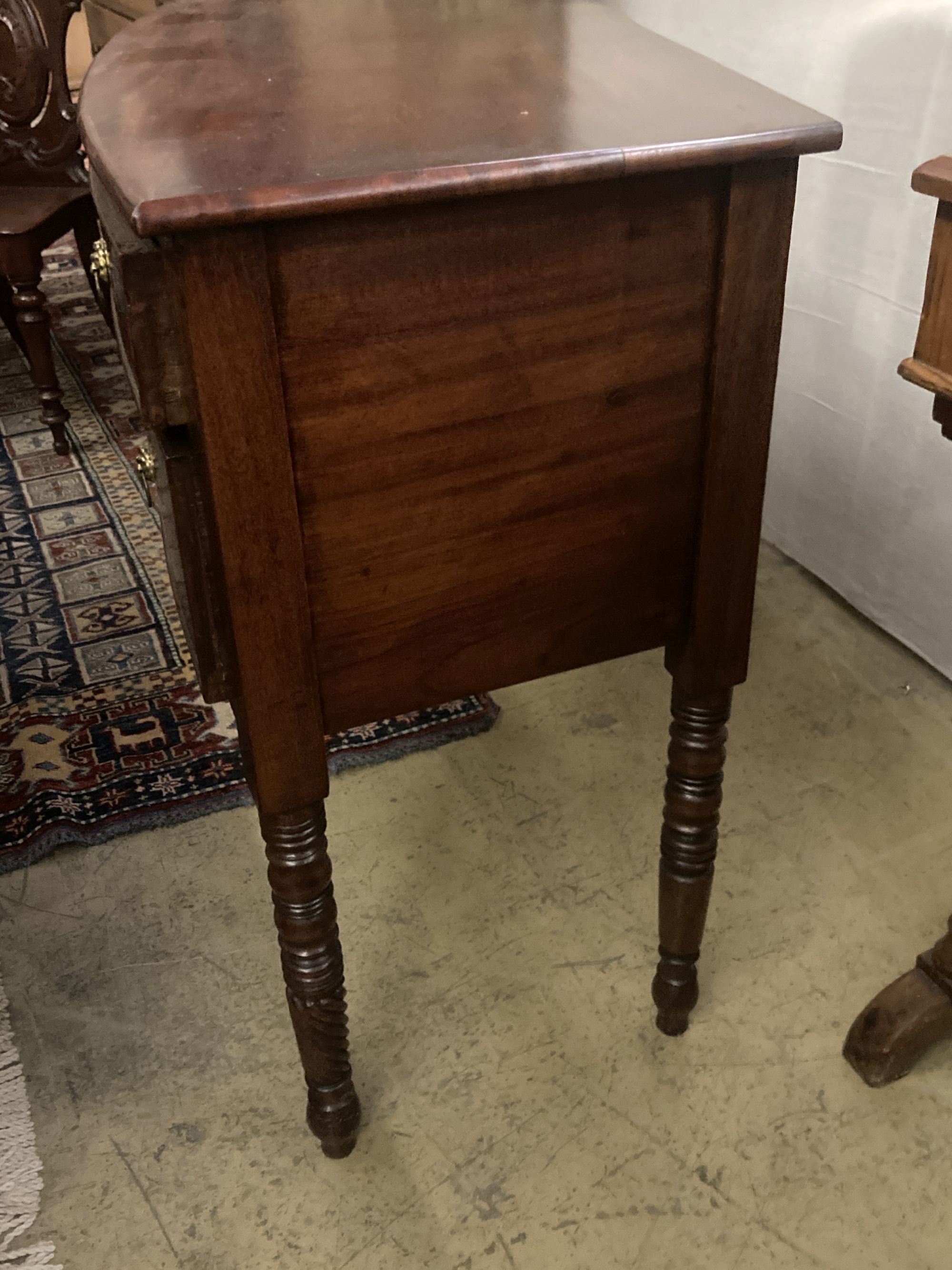 A Regency mahogany bowfront sideboard, width 145cm depth 51cm height 82cm